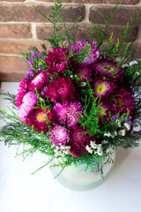 Bouquet of flowers in a vase on a white background. Autumn bouquet