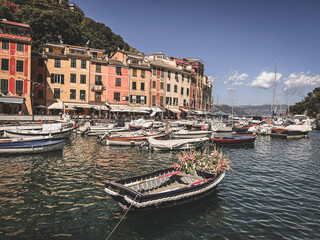 Portofino, Italy - July 8th, 2022: The beautiful Portofino with colorful houses and boats in little bay harbor. Liguria, Italy, Europe
