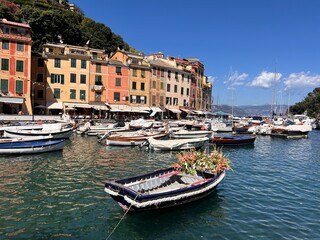 Portofino, Italy - July 8th, 2022: The beautiful Portofino with colorful houses and boats in little bay harbor. Liguria, Italy, Europe