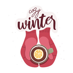 A cup of tea with lemon in the hands wearing mittens. Man's hands in warm red gloves holding a cup of tea. Winter concept. The inscription "cozy winter". Postcard Template