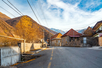 Fototapeta na wymiar Street in Ilisu village at autumn season. Northern Azerbaijan Gakh