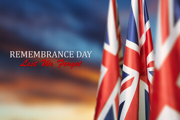 Flag of Great Britain with Text on background of sunset. Holidays of the UK. Remembrance Day.