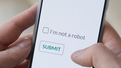 I m not a robot checkbox on phone screen with Submit button. Concept, technology, human check,...