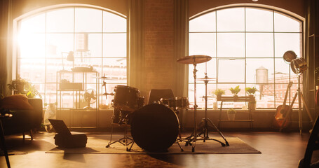 Establishing Shot: Music Rehearsal Studio in Loft Room with Drum Set in the Middle of It. Stylish...