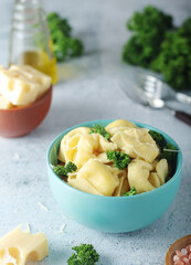 A bowl with Italian dumplings - tortellini	