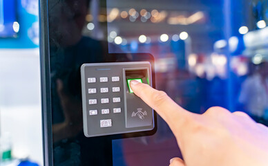 Staff push down electronic control machine with finger scan to access the door of or data center. The concept of data security or data access control.