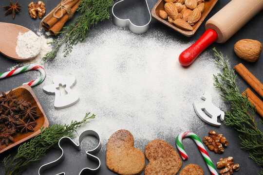 Cinnamon cookies, cookie cutters, candy canes, spices and christmas decorations. Flat lay, copy space