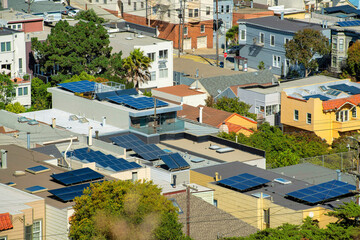 A great many rooftops with solar pannels and flat roofs in the historic districts of downtown san...