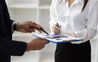 Meeting of financial advisors to discuss account analysis, financial reports and investment planning. Collaboration of colleagues in business organizations.