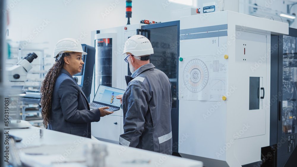 Poster two diverse professional heavy industry engineers wearing safety uniform and hard hats working on la