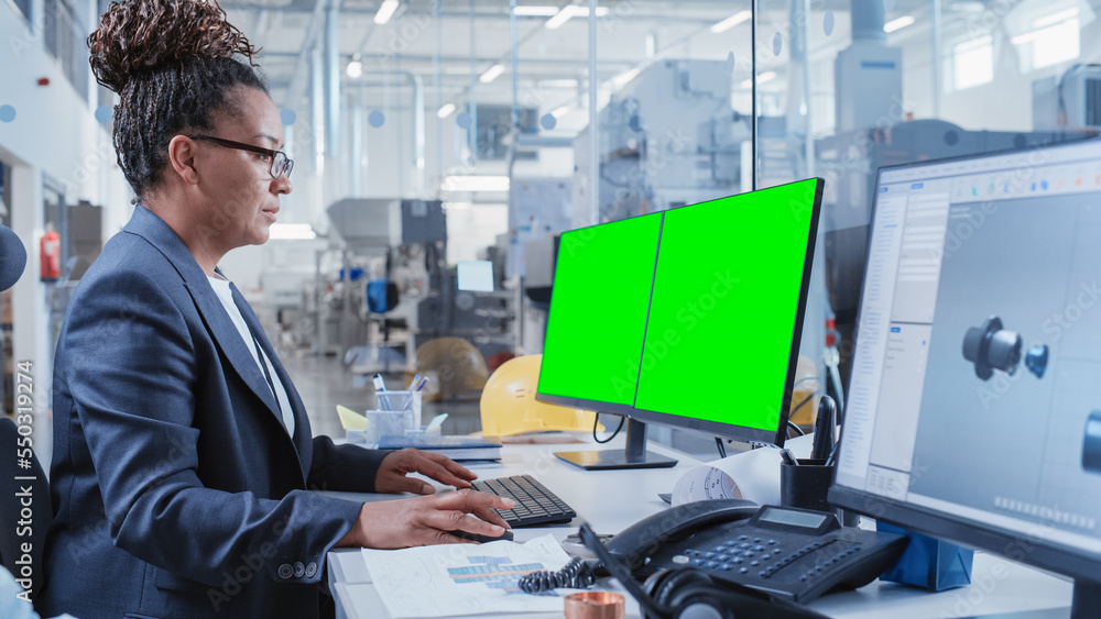 Leinwandbilder Factory Office Room: Industrial Engineers Developing Models of a Heavy Industry Machine Parts on a Computer 3D Software. One Computer Monitor Display is a Green Screen Mock Up Template.