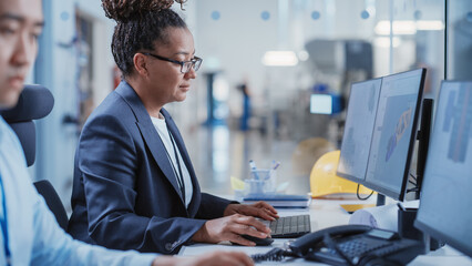 Factory Office Room: Industrial Engineers Developing Models of a Heavy Industry Machine Parts on a Computer 3D Software. Modern Technological Industry 4.0 Research and Development Center.