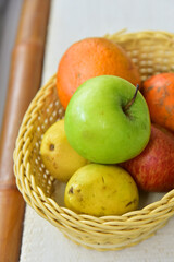 basket with apples and oranges