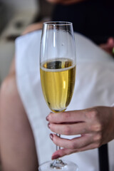 woman holding glass of champagne
