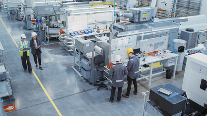 Industrial Factory: Team of Engineers, Technicians, Specialists and Workers, Working on Production...