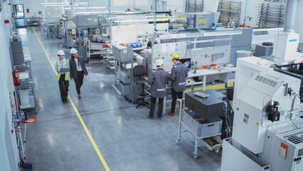 Industrial Factory: Diverse Multiethnic Team of Engineers, Technicians, Specialists and Workers,...