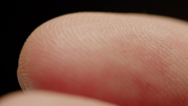 Fingerprint close up detail, human skin macro.