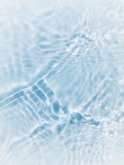 Defocus blurred transparent blue colored clear calm water surface texture with splashes and bubbles. Trendy abstract nature background. Water waves in sunlight with copy space. Blue watercolor shining