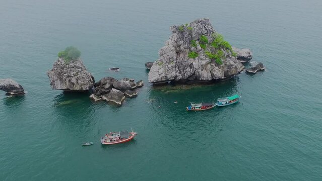 Aerial drone view of snorkelers with travel ship at Chumporn, Thailand