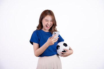 Asian woman smiling in blue t-shirt holding football to cheering the soccer game isolated on white screen background.