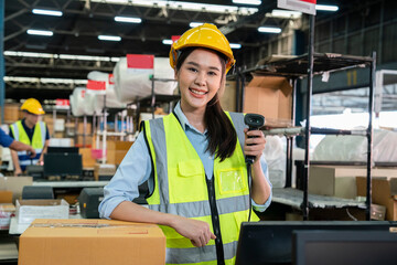 Asian female employees stand with scanners and pack products delivered to customers on time in warehouses and distribution centers.