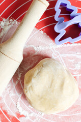 Dough, cookie cutter and rolling pin. The process of making homemade ginger and cinnamon Christmas...