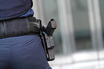 Illustrative image of a police pistol from behind