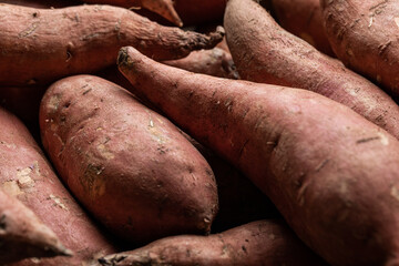Pile of uncooked sweet potato