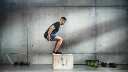 Online Workout Service: Professional Trainer Exercises, Video Tutorial, Virtual Training. Handsome Black Athletic Coach Teaching, Showing How to do Box Jumps. Wide Side View Shot