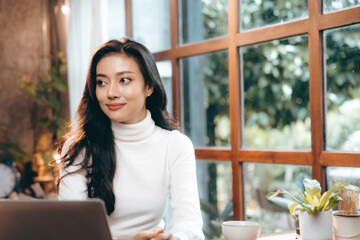 portrait of young business entrepreneur woman lifestyle, professional freelance businesswoman having smile and happy to work using computer laptop on online cyberspace technology, Asian beautiful girl