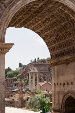 Old buildings behind triumphal arch
