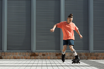 Roller skater in knee socks and shorts skating on urban street. © LIGHTFIELD STUDIOS