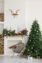 Stylish Scandinavian minimalistic Christmas interior with fireplace and Christmas tree. Cozy house....
