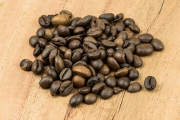 coffee beans on a wooden surface