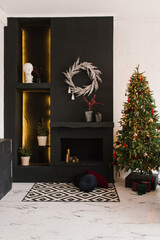 Stylish modern living room with fireplace and Christmas tree in black and white