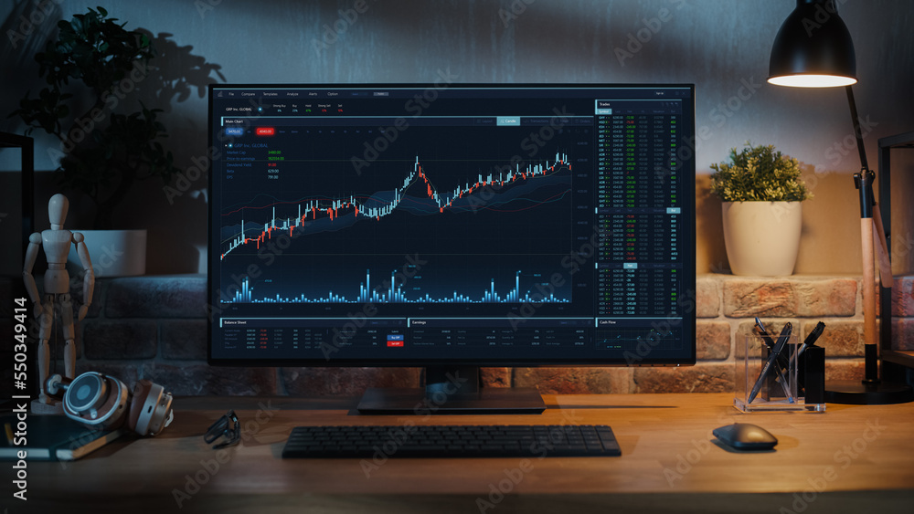 Fototapete Desktop Computer Monitor Standing on a Wooden Desk with Height Adjustable Function. Economic Charts and Statistics Displayed on Screen at Home in Modern Living Room or Creative Loft Office