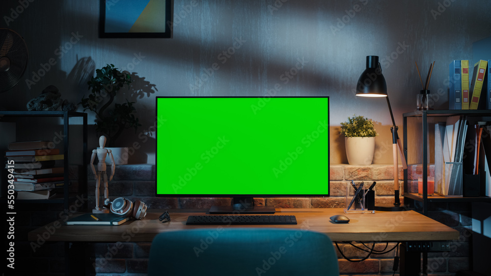Leinwandbilder desktop computer monitor with mock up green screen standing on a wooden desk with height adjustable 