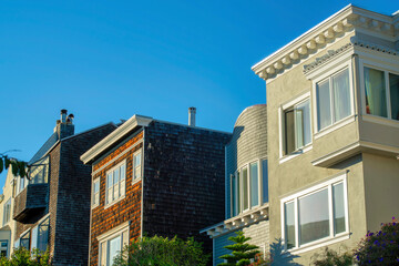 Row of decorative house facades in the historic districts of downtown san francisco california with stucco and wood exteriors