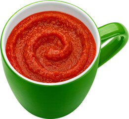 Tomato cream soup in green mug isolated