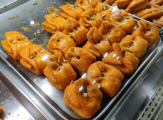 Lavang Latika is a traditional dessert of Bengal prepared especially on festivals. Coated with sugar syrup and crusty from outside but stuffed with mawa and dry fruits and with a clove on top. 