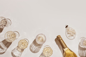 New Year holiday flat lay, white sparkling wine in crystal glasses, festive champagne drinks,...