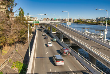 City traffic along Brisbane River on a major city road