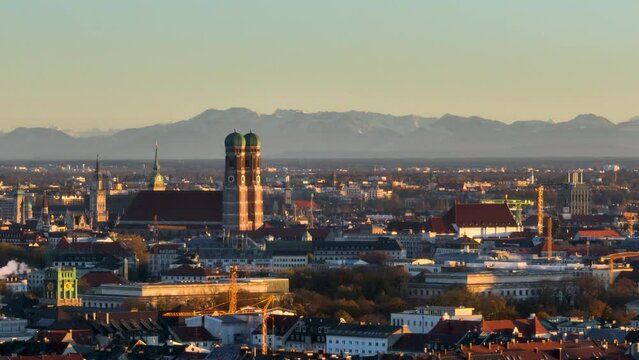 Frauenkirche against alpine panorama in Munich, Germany