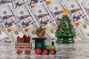 Wooden toy train, Christmas tree and American money