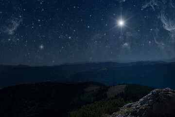 The star shines over the manger of christmas of Jesus Christ.