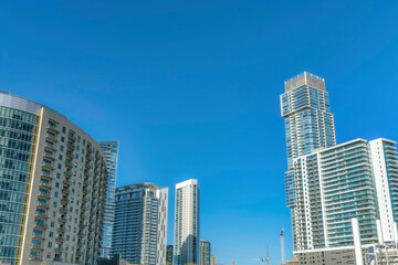 Fototapeta na wymiar Austin Texas skyline with exterior view of luxury apartments against blue sky