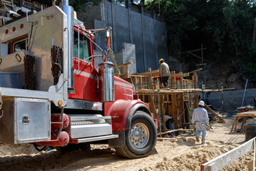 Construction site with truck delivering materials