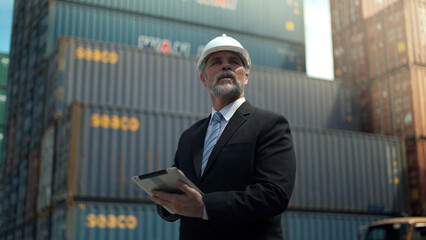 Manager load container for shipping plan in Logistic container area company.