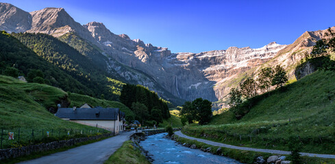 Gavarnie town and the famous waterfall on Pyrenees Orientals mountains at France Spain border - obrazy, fototapety, plakaty