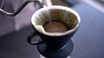 Close up barista making drip coffee.